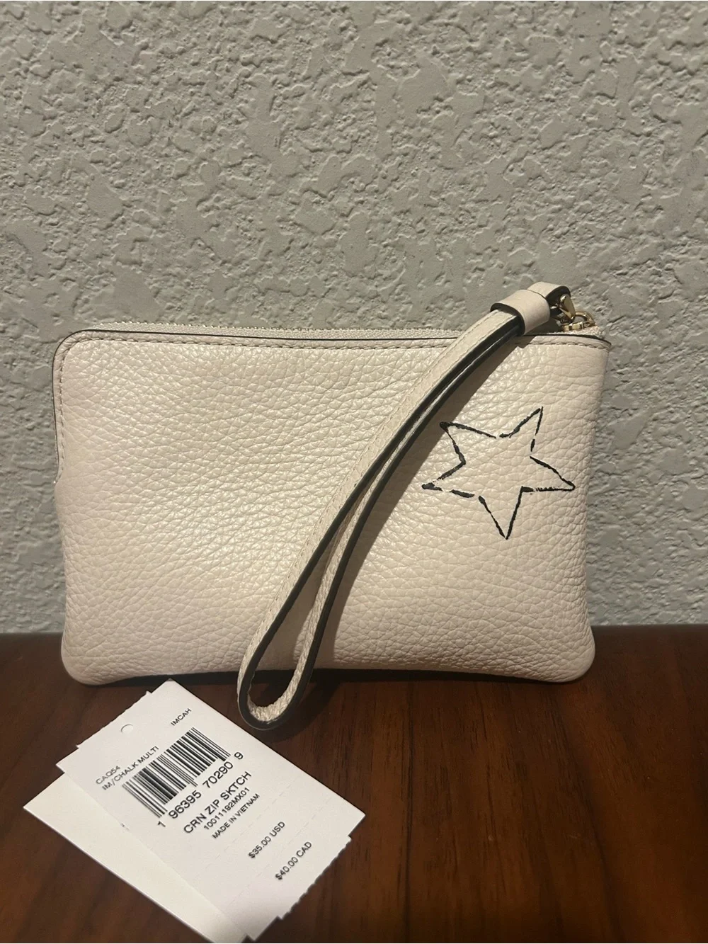 Coach White Zip Sketch Wristlet with Yellow Logo and Butterfly Accent